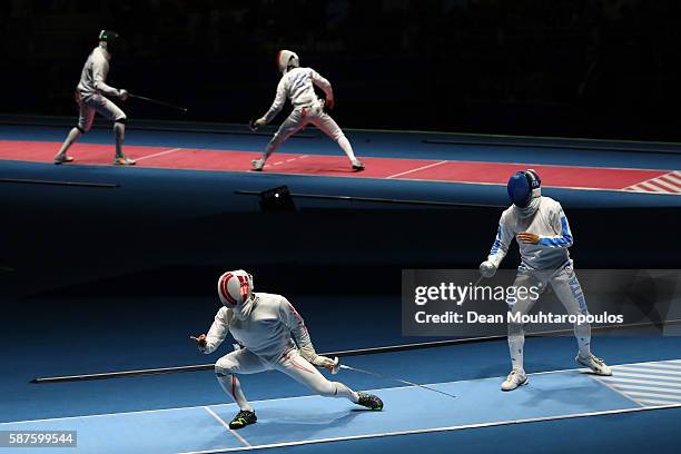 Kazuyasu Minobe of Japan reacts duing the match Marco Fichera of Italy during the Men's Epee Individual against on Day 4 of the Rio 2016 Olympic...