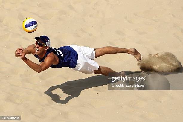 Nicholas Lucena of United States bumbs the ball during the Men's Beach Volleyball Preliminary Pool C match against Rodolfo Lombardo Ontiveros Gomez...