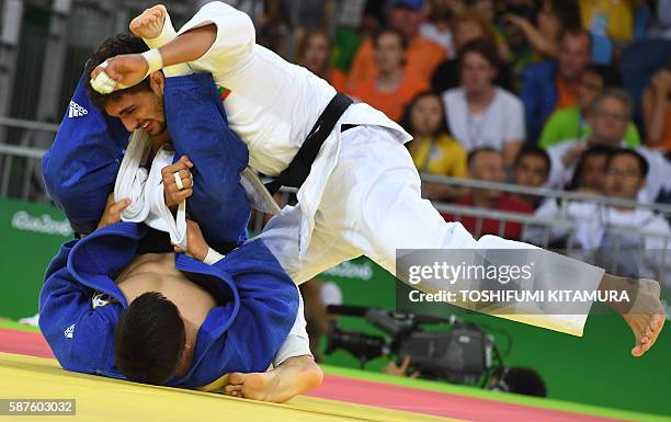 Bulgaria's Ivaylo Ivanov competes with South Korea's Lee Seungsu during their men's -81kg judo contest match of the Rio 2016 Olympic Games in Rio de...