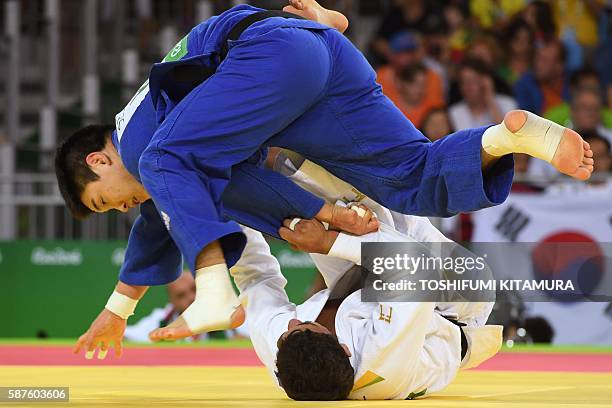 Bulgaria's Ivaylo Ivanov competes with South Korea's Lee Seungsu during their men's -81kg judo contest match of the Rio 2016 Olympic Games in Rio de...