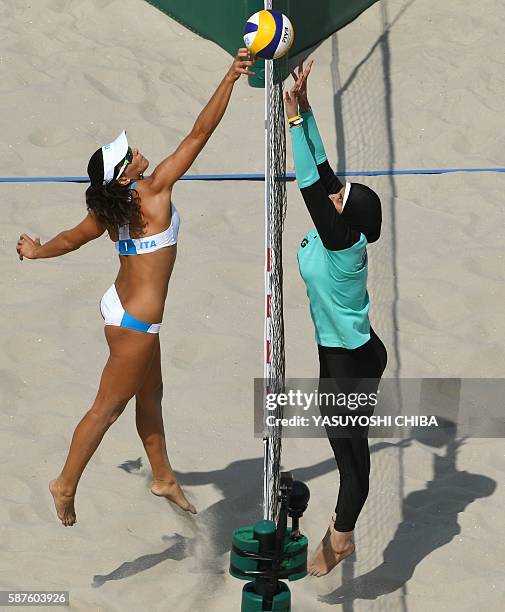 Italy's Marta Menegatti jumps for the ball during the women's beach volleyball qualifying match between Italy and Egypt at the Beach Volley Arena in...