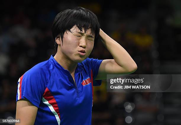 North Korea's Kim Song I reacts between points against Singapore's Yu Mengyu in their women's singles quarter-final table tennis match at the...