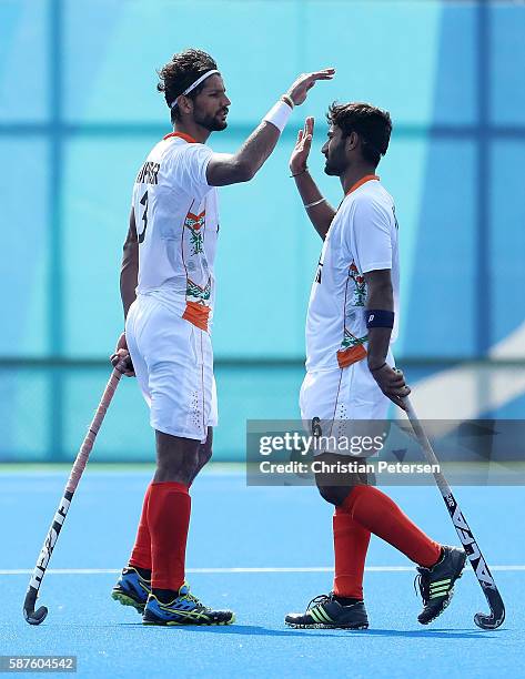 Rupinder Pal Singh and Surender Kumar of India celebrate after defeating Argentina 2-1 following the hockey game on Day 4 of the Rio 2016 Olympic...