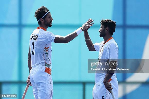 Rupinder Pal Singh and Surender Kumar of India celebrate after defeating Argentina 2-1 following the hockey game on Day 4 of the Rio 2016 Olympic...