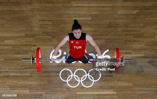 Mehtap Kurnaz of Turkey competes during the Women's 63kg Group B Weightlifting contest on Day 4 of the Rio 2016 Olympic Games at the Riocentro -...