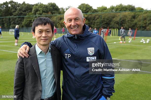 The new prospective owner of West Bromwich Albion, Guochuan Lai from Yunyi Guokai Sports Development Limited meets Tony Pulis the head coach of West...