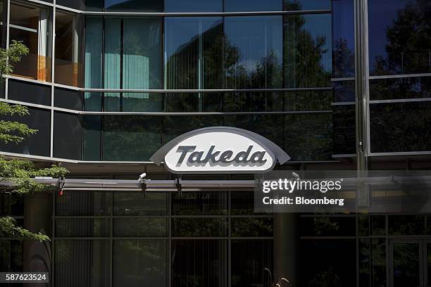 Signage for Tekeda Pharmaceutical Co. Is displayed on the exterior of the company's building in Cambridge, Massachusetts, U.S., on Friday, Aug. 5,...