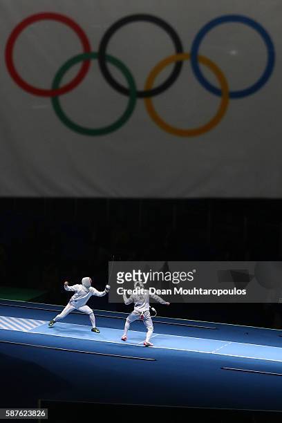 Kazuyasu Minobe of Japan in action against Gauthier Grumier of France in the Men's Epee Individual on Day 4 of the Rio 2016 Olympic Games on August...