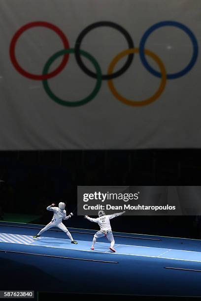 Kazuyasu Minobe of Japan in action against Gauthier Grumier of France in the Men's Epee Individual on Day 4 of the Rio 2016 Olympic Games on August...