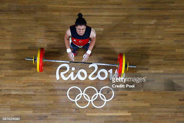 Mehtap Kurnaz of Turkey reacts during the Women's 63kg Group B Weightlifting contest on Day 4 of the Rio 2016 Olympic Games at the Riocentro -...