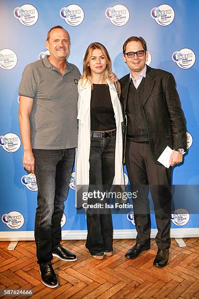 Goetz Elbertzhagen, his girlfriend Lydia Becker and photographer, artist and performer Peter Badge attend the photo exhibition 'Die Kunst des...