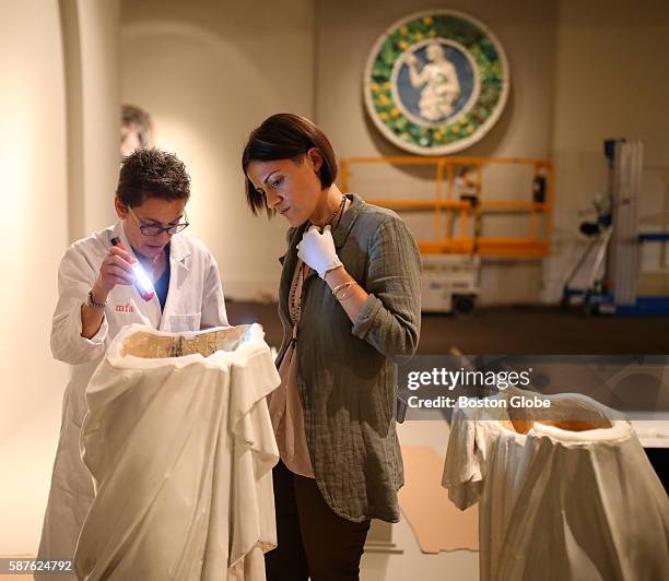 Pamela Hatchfield , head of MFA object conservation, and Shrin Afra , a conservator from the Opificio delle Pietr'e Dure in Florence, inspected a...