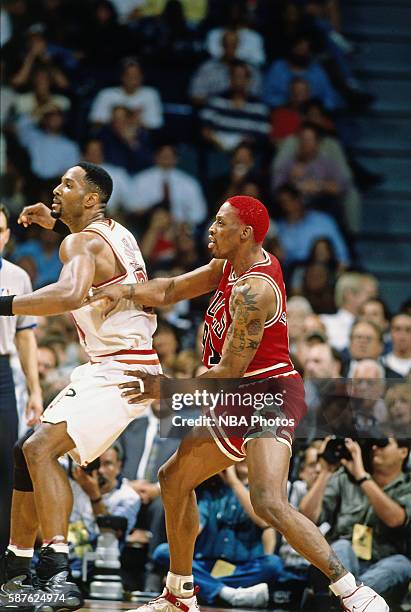 Dennis Rodman of the Chicago Bulls defends against Alonzo Mourning of the Miami Heat on April 2, 1996 at Miami Arena in Miami, Florida. NOTE TO USER:...