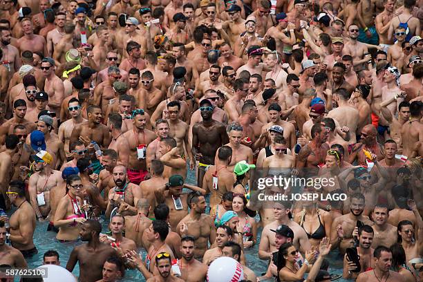 Revellers party in a swimming pool during the Circuit Festival's Water Park Day, an open air gay party in Vilassar de Mar, near Barcelona, on August...