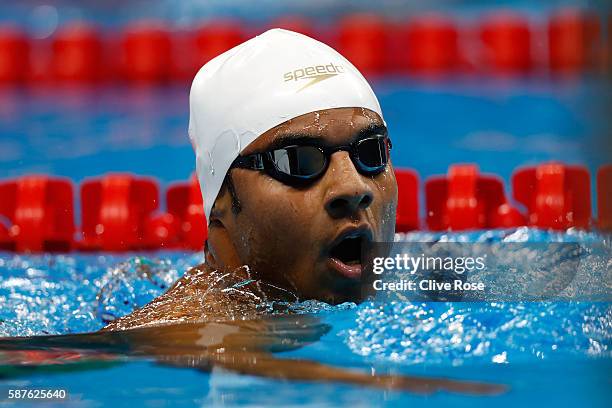 Rami Anis of the Refugee Olympic Team reacts after the Men's 100m Freestyle heat on Day 4 of the Rio 2016 Olympic Games at the Olympic Aquatics...