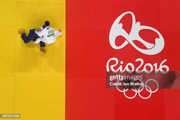 Juan Diego Turcios of Estonia and Avtandili Tchrikishvili of Georgia compete during the Men's -81kg bout on Day 4 of the Rio 2016 Olympic Games at...