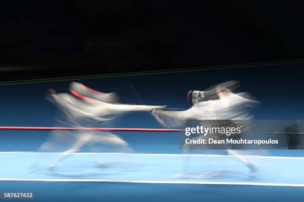 Kazuyasu Minobe of Japan in action against Gauthier Grumier of France during the quarterfinal in the Men's Epee Individual on Day 4 of the Rio 2016...