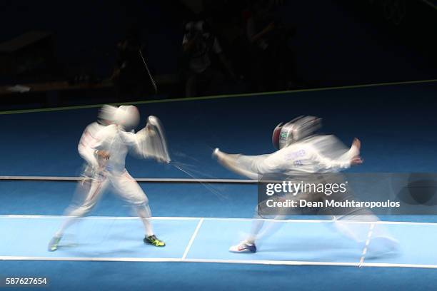Kazuyasu Minobe of Japan in action against Gauthier Grumier of France during the quarterfinal in the Men's Epee Individual on Day 4 of the Rio 2016...