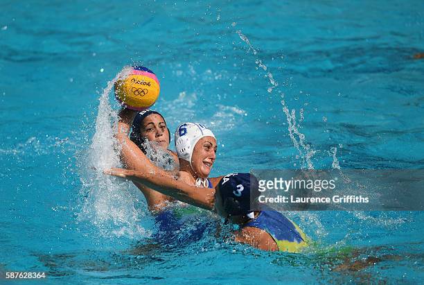 Rosaria Aiello of Italy shoots under pressure from Marina Zablith of Brazil during Water Polo Preliminary Round Group B match on Day 4 of the Rio...