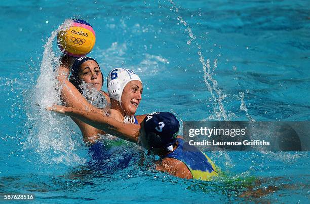 Rosaria Aiello of Italy shoots under pressure from Marina Zablith of Brazil during Water Polo Preliminary Round Group B match on Day 4 of the Rio...