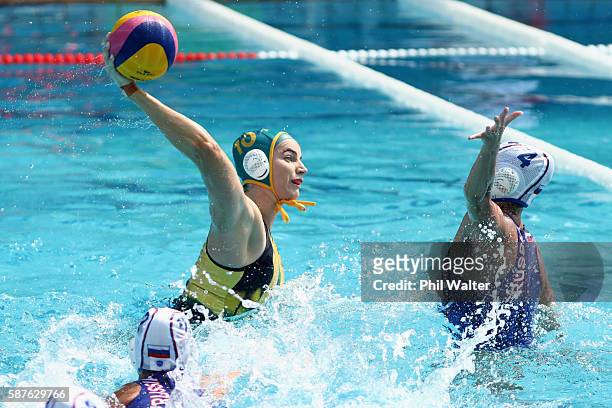 Ash Southern of Australia shoots at goal over Elvina Karimova of Russia during the Preliminary Round, Group A Womens Waterpolo match between Russia...
