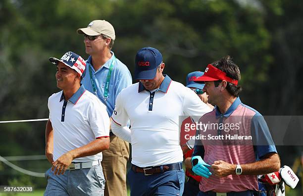 Rickie Fowler, Matt Kuchar and Bubba Watson of the United States walk down a fairway with Gil Hanse during a practice round on Day 4 of the Rio 2016...