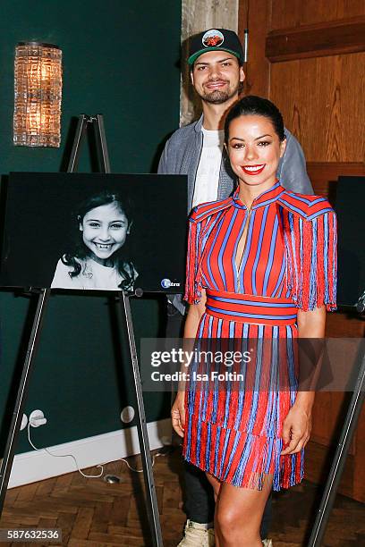 German actor Jimi Blue Ochsenknecht and brazilian singer Fernanda Brandao attend the photo exhibition 'Die Kunst des Kinderlaechelns' by Peter Badge...