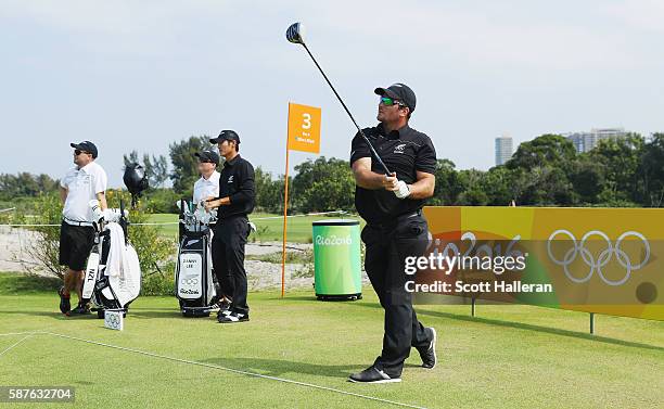 Ryan Fox of New Zealand watches a tee shot as Danny Lee looks on during a practice round on Day 4 of the Rio 2016 Olympic Games at Olympic Golf...