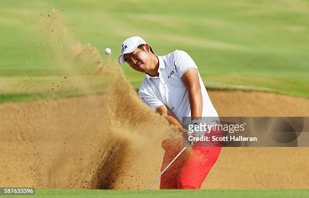 Byeong-hun An of Korea plays a bunker shot during a practice round on Day 4 of the Rio 2016 Olympic Games at Olympic Golf Course on August 9, 2016 in...
