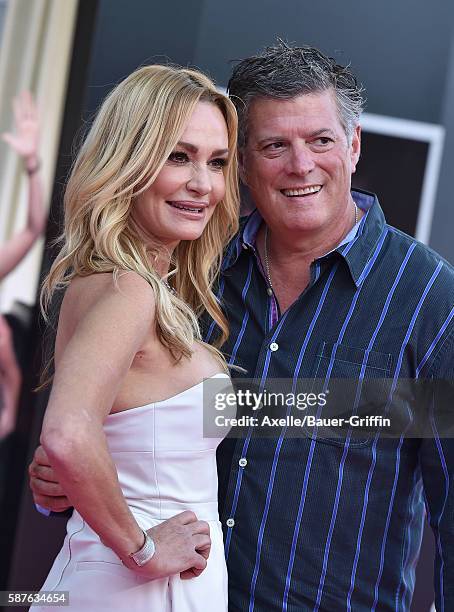 Personality Taylor Armstrong and husband John Bluher arrive at the premiere of STX Entertainment's 'Bad Moms' at Mann Village Theatre on July 26,...