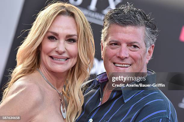 Personality Taylor Armstrong and husband John Bluher arrive at the premiere of STX Entertainment's 'Bad Moms' at Mann Village Theatre on July 26,...