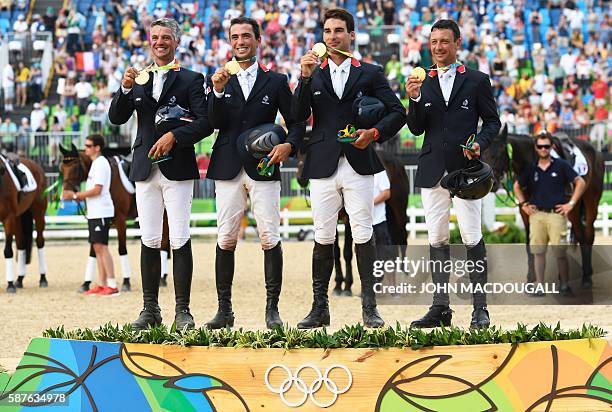 France's Karim Laghouag, France's Mathieu Lemoine, France's Astier Nicolas and France's Thibaut Vallette celebrate with their gold medals on the...