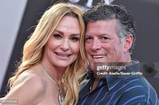 Personality Taylor Armstrong and husband John Bluher arrive at the premiere of STX Entertainment's 'Bad Moms' at Mann Village Theatre on July 26,...