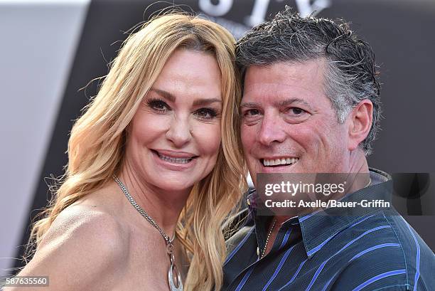 Personality Taylor Armstrong and husband John Bluher arrive at the premiere of STX Entertainment's 'Bad Moms' at Mann Village Theatre on July 26,...