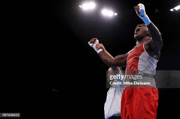 Laurent Clayton Jr of the US Virgin Islands celebrates winning his fight against Erik Pfeifer Of Germany in their Mens Super Heavyweight +91kg bout...
