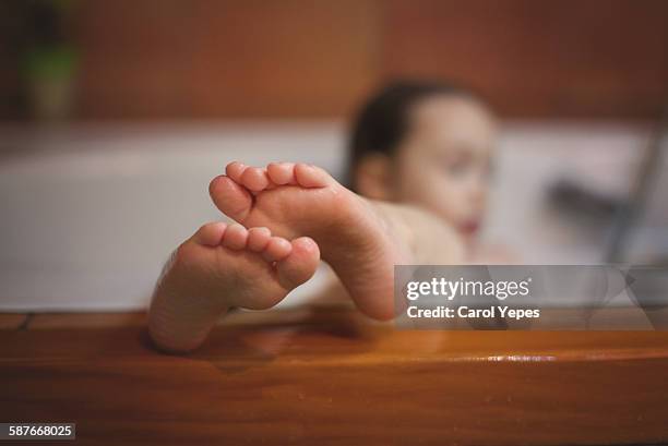 girl´s feet in tube - tube feet stock pictures, royalty-free photos & images