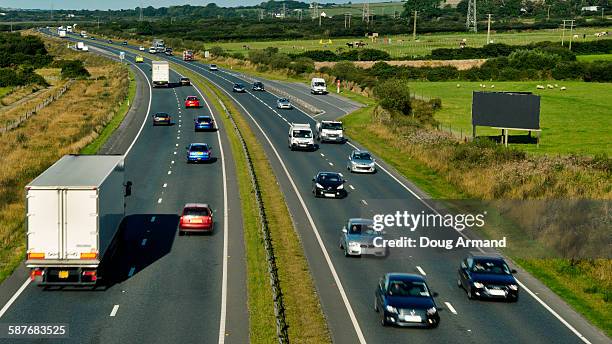 mixed traffic on a dual carriageway - southwest england stock pictures, royalty-free photos & images
