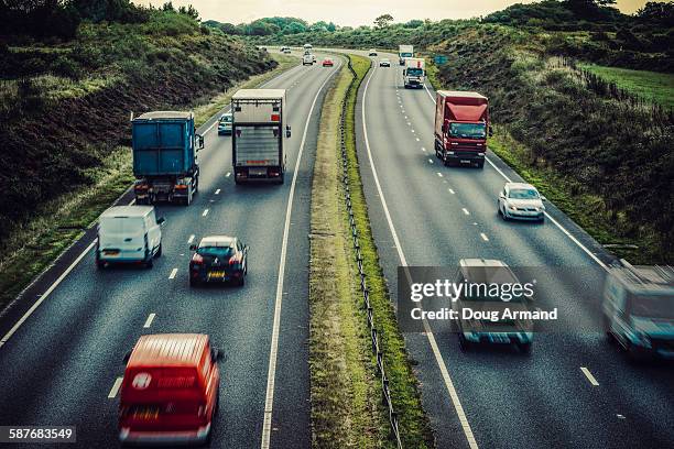 mixed traffic on a dual carriageway - southwest england stock pictures, royalty-free photos & images