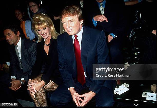 Left to right, Rofredo Gaetani, Ivana Trump, and Donald Trump attend the Betsey Johnson fashion show at Bryant Park, New York, 1997.