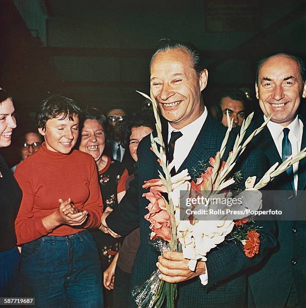 Slovak politician and First Secretary of the Communist Party of Czechoslovakia, Alexander Dubcek pictured holding a bunch of flowers soon after being...