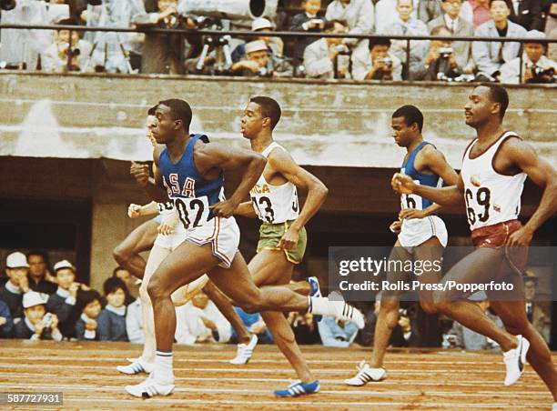 American athlete Bob Hayes pictured in action winning his semifinal race of the Men's 100 metres competition at the 1964 Summer Olympics in Tokyo,...
