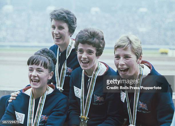 View of the Great Britain team, third place winners of the women's 4 x 100 metres relay competition, pictured with their bronze medals at the 1964...