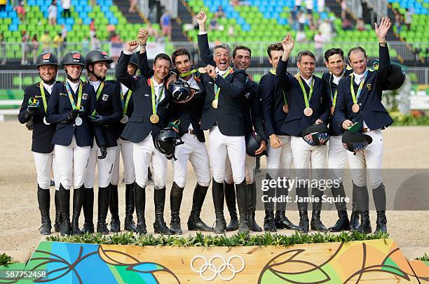 Silver medalists Julia Krajewski, Sandra Auffarth, Ingrid Klimke and Michael Jung of Germany, Gold medal medalists Karim Laghouag, Thibaut...