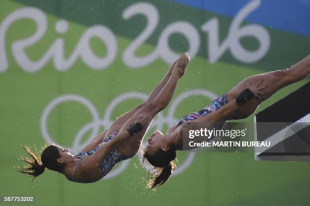 Brazil's duet Ingrid Oliveira and Giovanna Pedroso compete in the Women's Synchronised 10m Platform Final during the diving event at the Rio 2016...