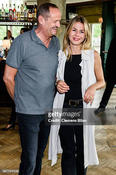 Goetz Elbertzhagen and his girlfriend Lydia Becker attend Photo exhibition 'Die Kunst des Kinderlaechelns' by Peter Badge on August 9, 2016 in...