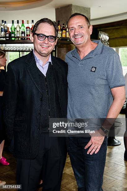 Peter Badge, Goetz Elbertzhagen attend Photo exhibition 'Die Kunst des Kinderlaechelns' by Peter Badge on August 9, 2016 in Berlin, Germany....