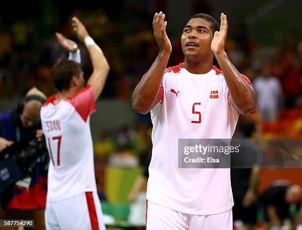 Mads Mensah Larsen of Denmark salutes the fans after the match against Tunisia on Day 4 of the Rio 2016 Olympic Games at the Future Arena on August...