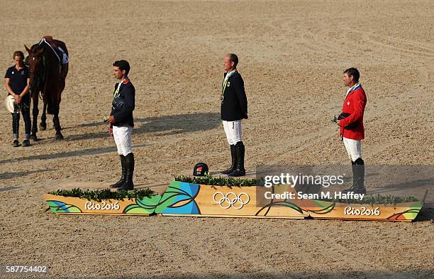 Silver medalist Astier Nicolas of France, Gold medal medallist Michael Jung of Germany and bronze medallist Phillip Dutton of the United States pose...