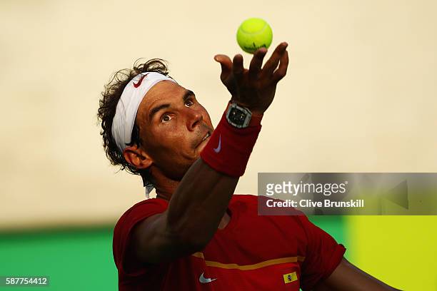 Rafael Nadal of Spain serves during the men's second round single match against Andreas Seppi of Italy on Day 4 of the Rio 2016 Olympic Games at the...