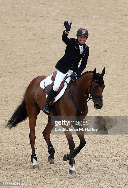 Michael Jung of Germany celebrates winning the gold medal for the eventing Individual final on Day 4 of the Rio 2016 Olympic Games at the Olympic...